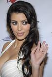 Kim Kardashian in white low-cute dress showing huge cleavage at pre-BET awards party in Los Angeles