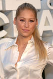 Anna Kournikova shows her long legs in black mini skirt and give a peek at her black bra under white blouse at Chanel 2008/09 Cruise Show in Miami